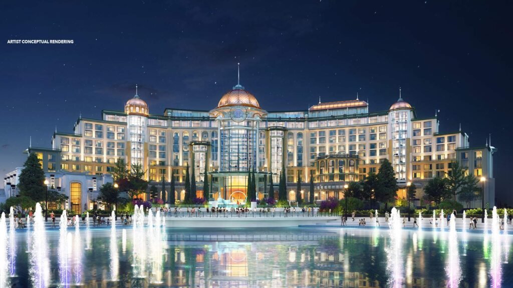 Helios Grand Hotel at Universal Orlando 2025 illuminated at night with a large fountain in the foreground, artist conceptual rendering by Universal Studios.