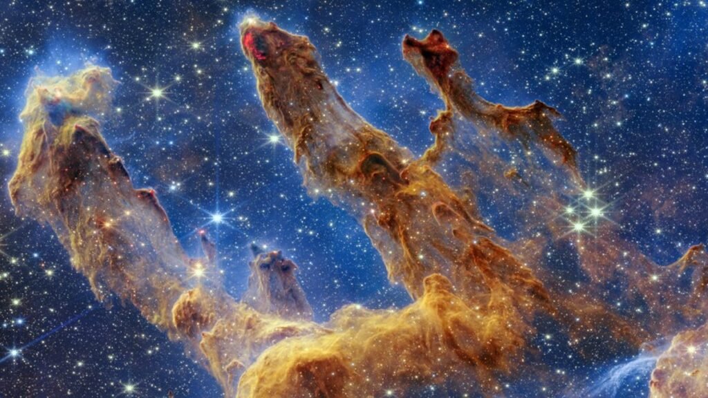 A vibrant image of the Pillars of Creation within the Eagle Nebula, showcasing towering columns of interstellar gas and dust illuminated by starlight.