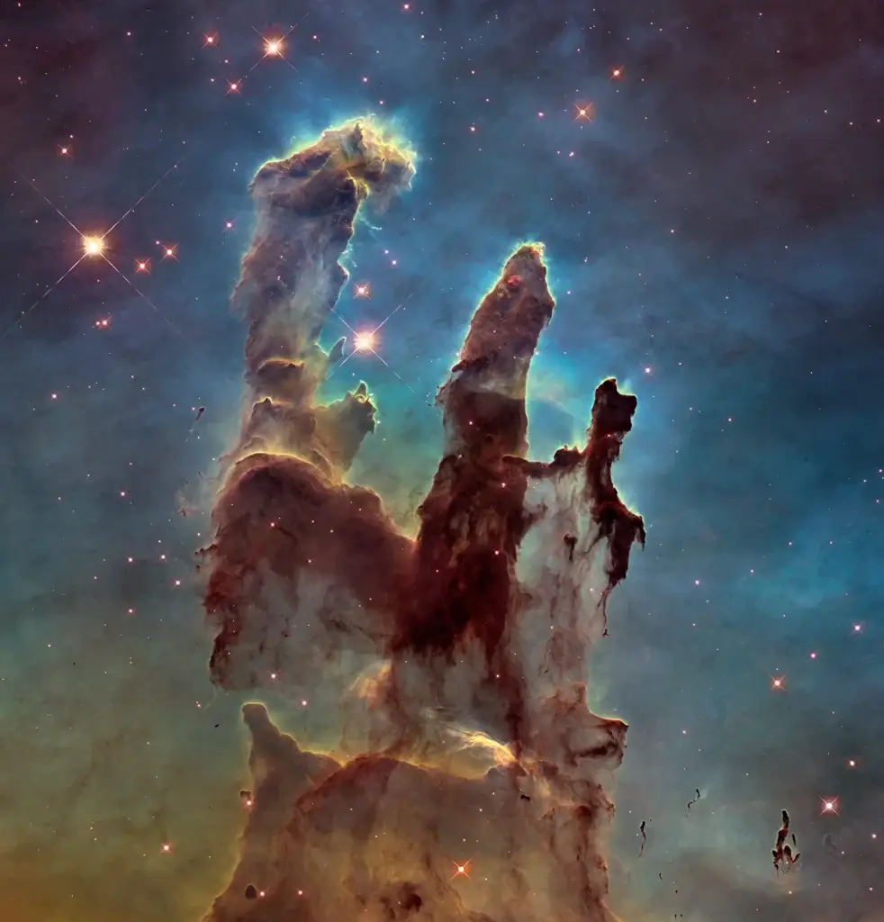 A stunning image of the Pillars of Creation within the Eagle Nebula, featuring towering columns of interstellar gas and dust illuminated by starlight.