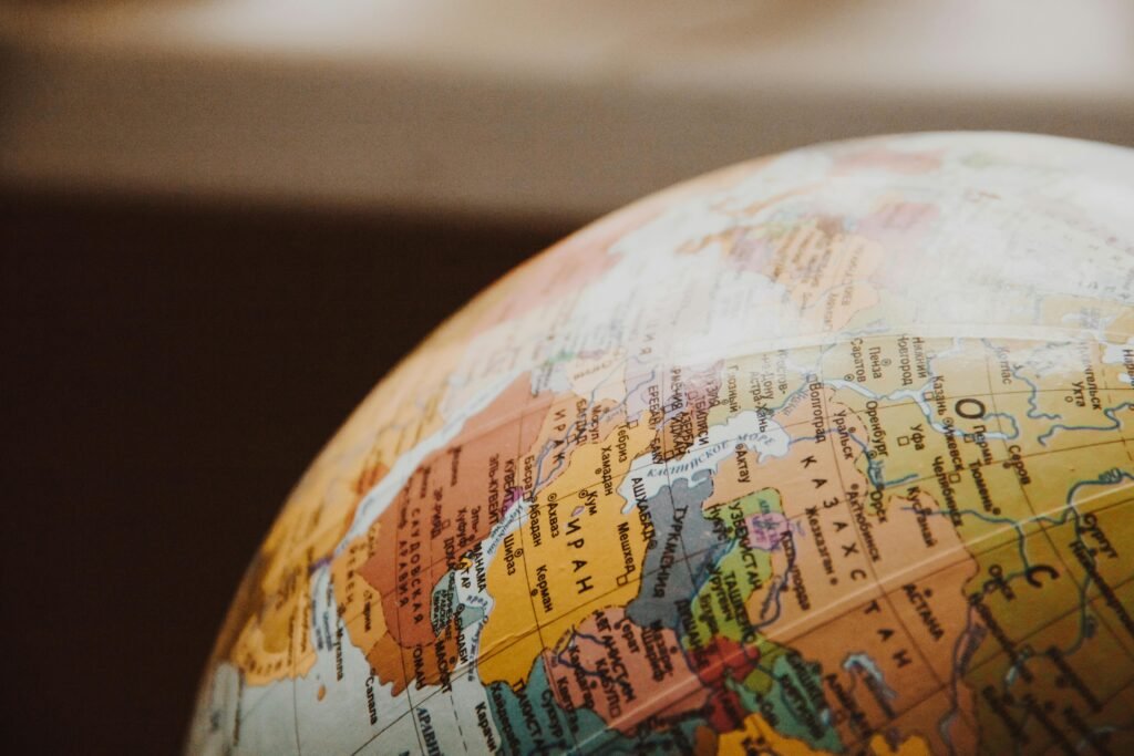 Close-up of a globe showing continents and countries with focus on the Northern Hemisphere.