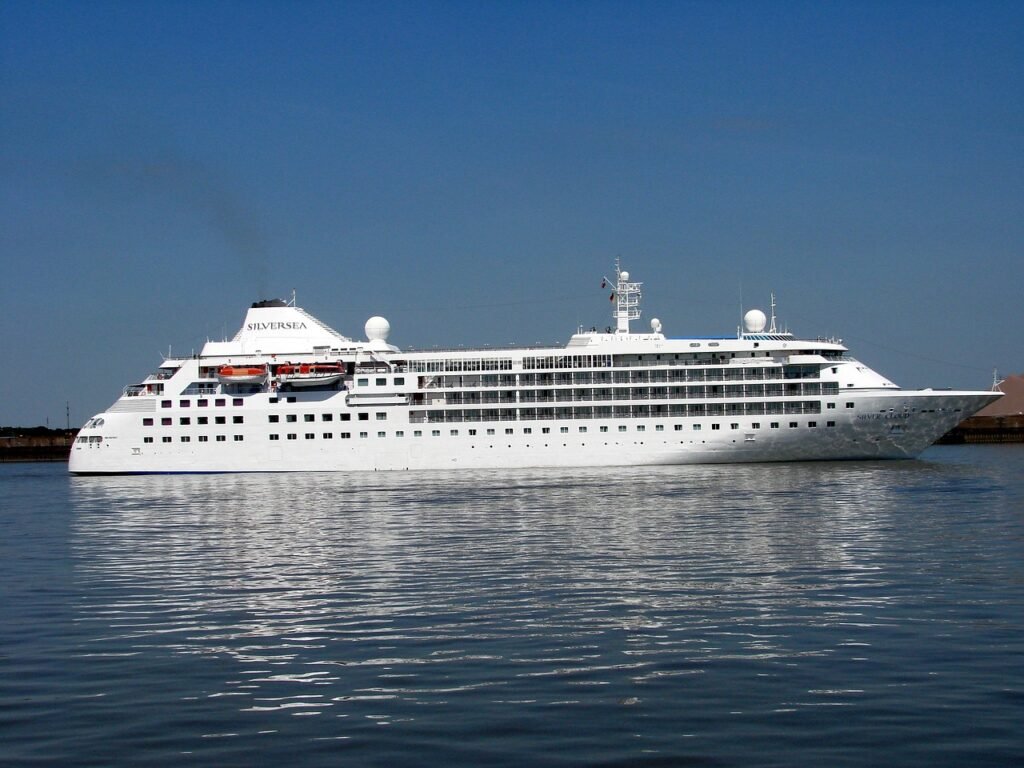 Luxury cruise ship Silversea on calm blue waters under a clear sky.