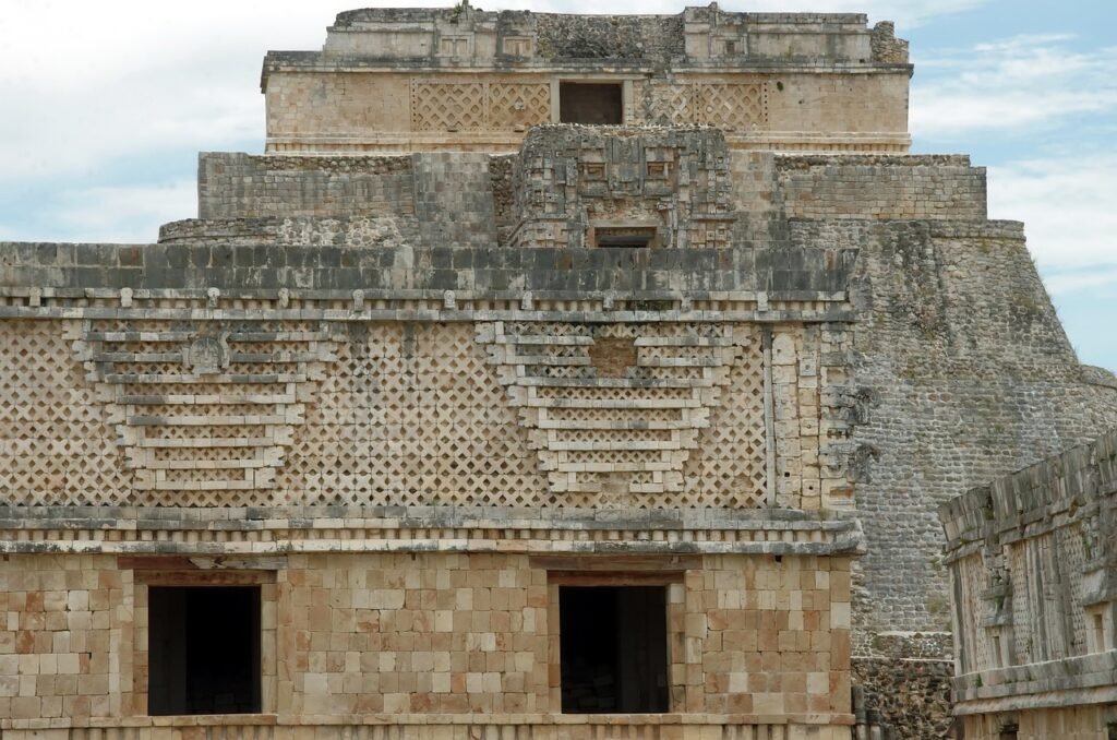 mexico, uxmal, pyramid. Ancient Mesoamerican pyramid with intricate stone carvings and geometric patterns.