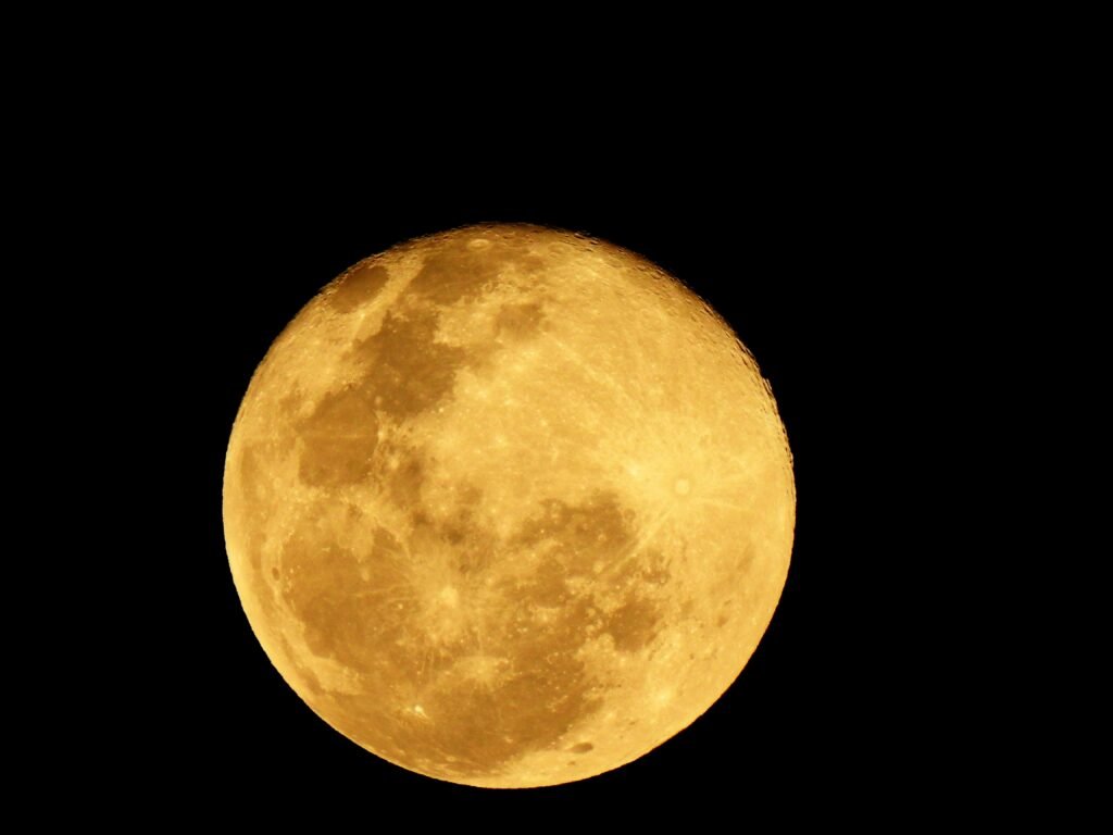 A full moon captured in detail against a dark night sky.