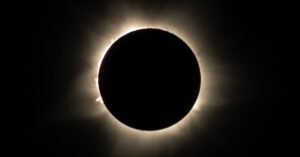 Total solar eclipse with corona visible around the moon’s silhouette, part of October 2024 Celestial Events.