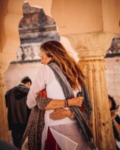 Two people hugging under an ornate archway in a historical setting showing Kindness and Boundaries