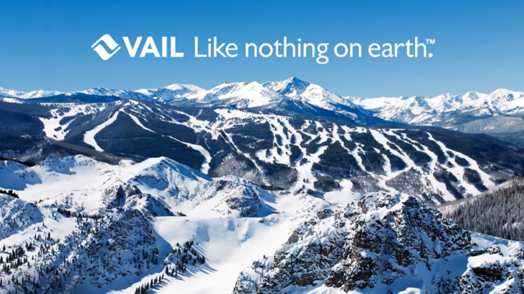 Snow-covered mountains with text overlay saying 'Vail - Like Nothing on Earth